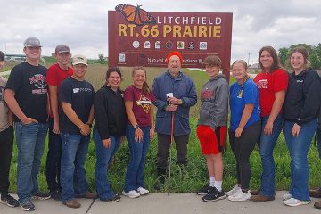 Group in front of Monarch sign - Litchfield Route 66 Prairie